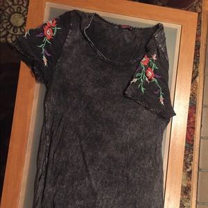 Embroidered short-sleeved top by local designer